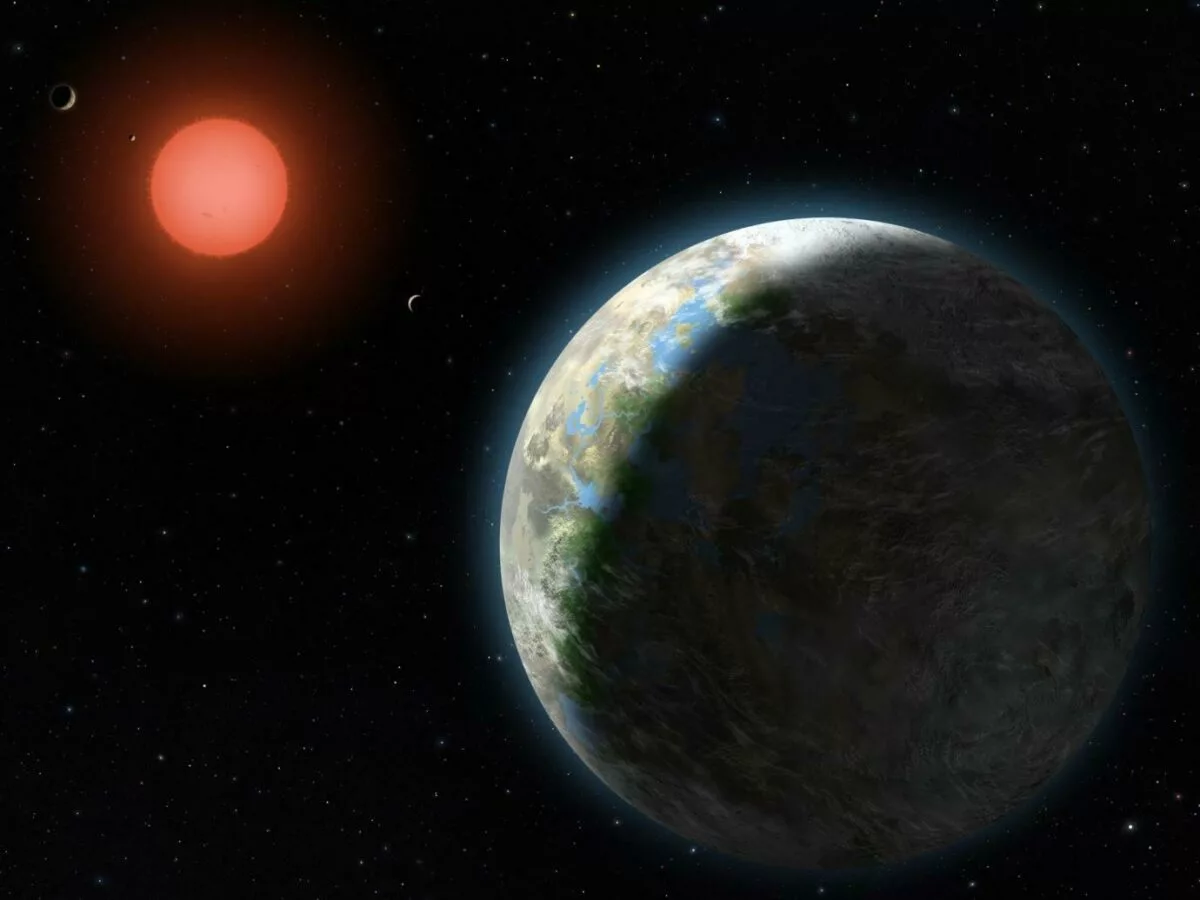 Este conceito artístico mostra um mundo parecido com a Terra, com nuvens e água líquida na superfície, orbitando uma estrela anã vermelha. Imagem: Universidade de Chicago